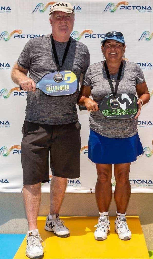 Becky with her husband after receiving the gold medal in their first pickleball tournament last year at Pictona. They play in a large number of charity pickleball tournaments. Recently, she introduced pickeball to both her Norwegian team and to the GM in Yantai for Air Products.