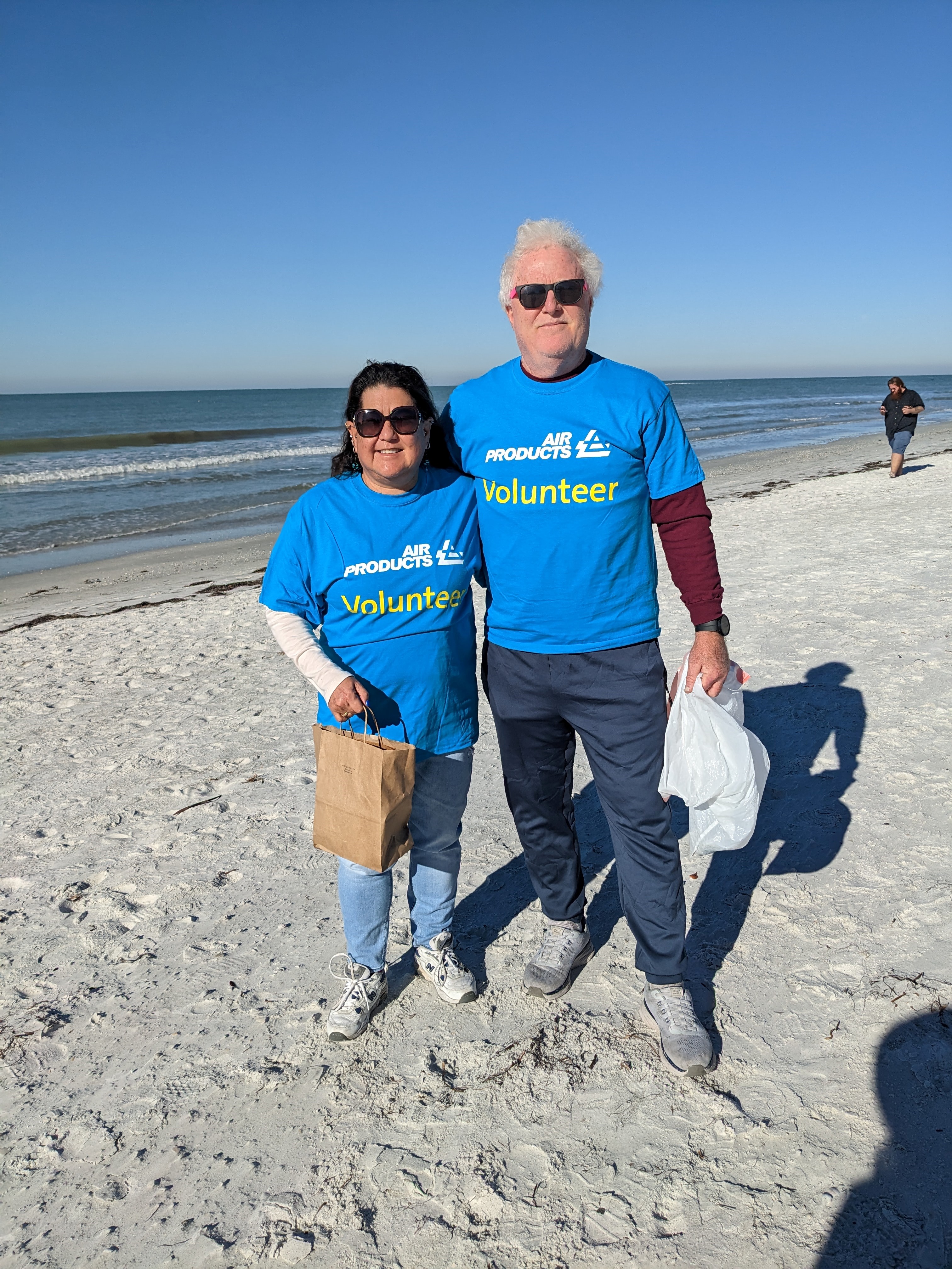 Becky alongside her husband, Tom, cleaning up Indian Rocks Beach near their home for Volunteer Day/MLK Day of Service for Air Products.