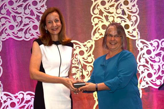 Sharon Beshouri (left) receives AIChE's 2019 AGILE Award from AIChE President Kimberly Ogden.