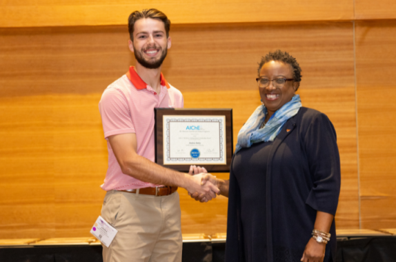 AIChE president Christine Grant presented Andrew Berley with the John J. McKetta Undergraduate Scholarship award at the AIChE 2022 Annual Student Conference.